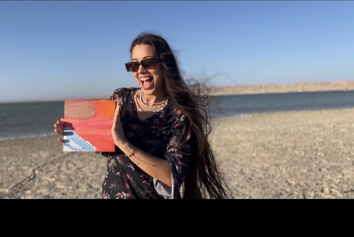 Painting by the sea at an UNLEASH retreat