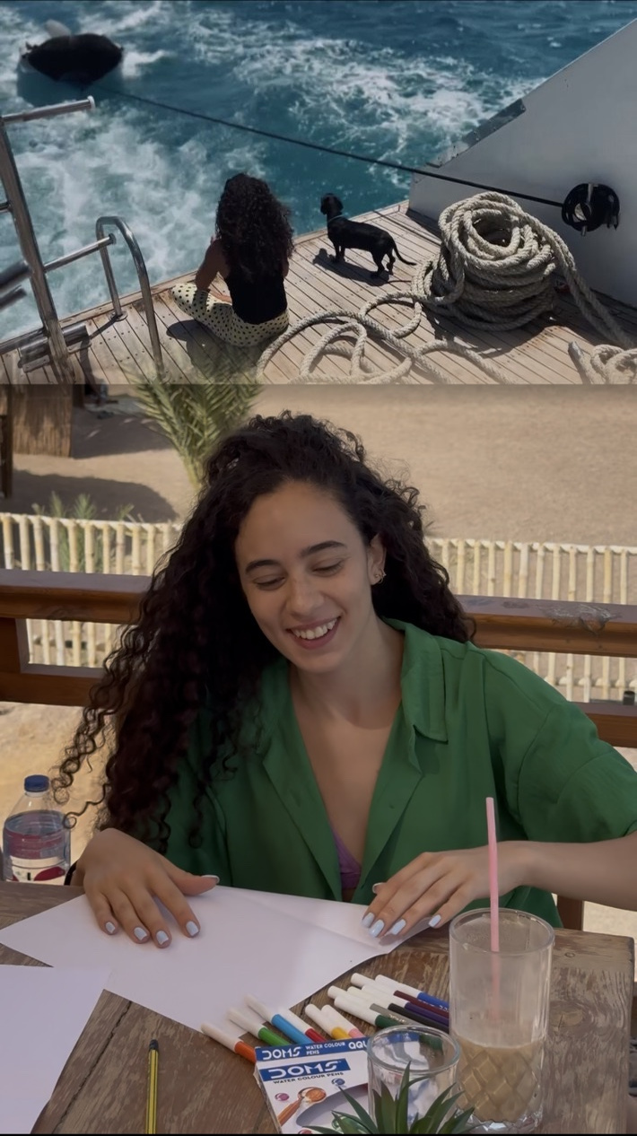Original UNLEASH participant at the art table, with an edited sea landscape above; face unchanged